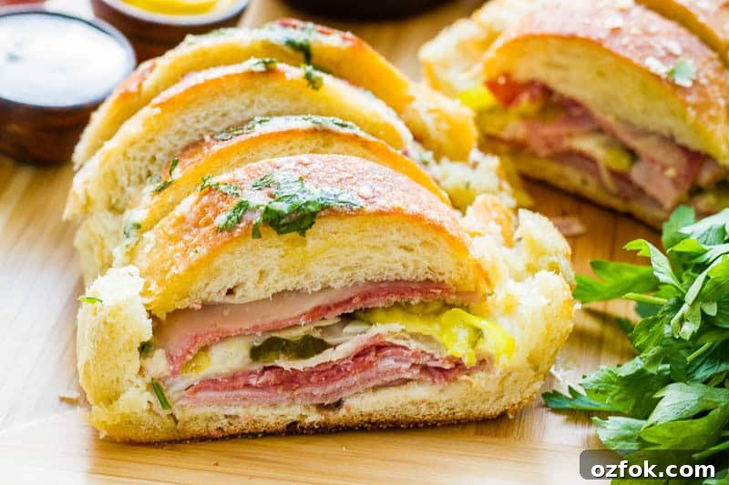 Garlic Bread Sandwich Loaf: Savory Pull-Apart Recipe 2 Why make individual sandwiches when you can make one BIG one that feeds everyone? This Garlic Bread Sandwich Loaf recipe has loads of goodies layered inside, then it's doused with a combination of melted butter, garlic, parmesan and parsley. It is AMAZING!! AND EASY!!
