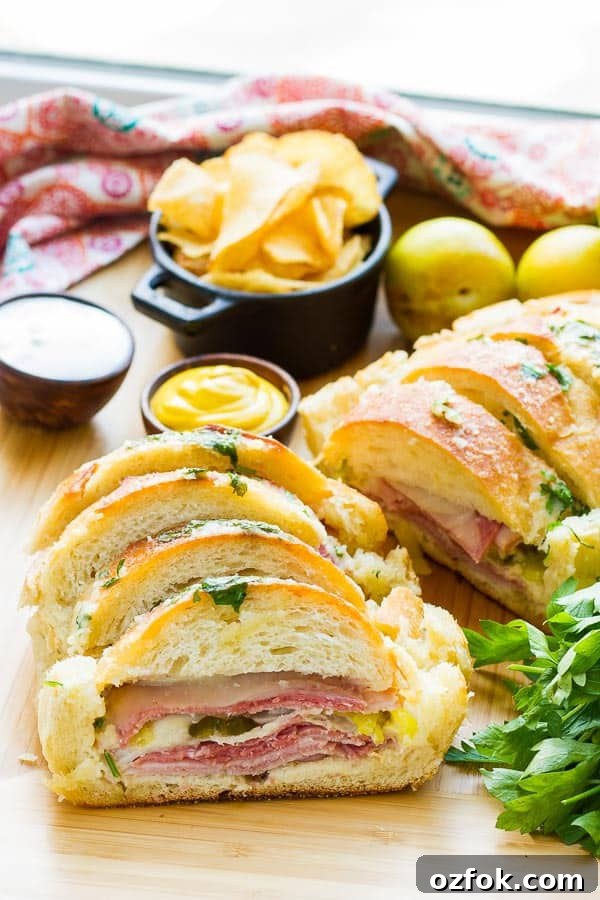 Garlic Bread Sandwich Loaf: Savory Pull-Apart Recipe 3 Why make individual sandwiches when you can make one BIG one that feeds everyone? This Garlic Bread Sandwich Loaf recipe has loads of goodies layered inside, then it's doused with a combination of melted butter, garlic, parmesan and parsley. It is AMAZING!! AND EASY!!