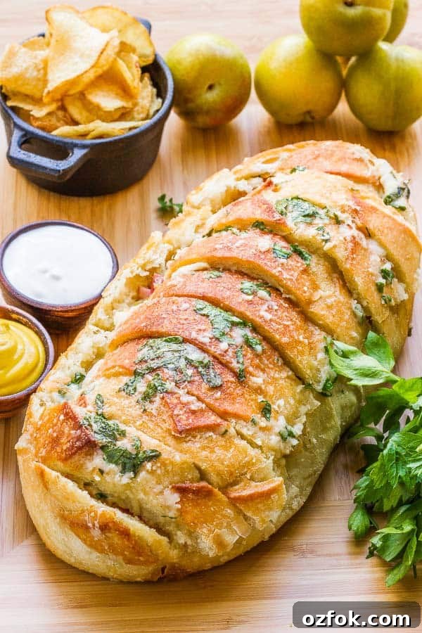Garlic Bread Sandwich Loaf: Savory Pull-Apart Recipe 4 Why make individual sandwiches when you can make one BIG one that feeds everyone? This Garlic Bread Sandwich Loaf recipe has loads of goodies layered inside, then it's doused with a combination of melted butter, garlic, parmesan and parsley. It is AMAZING!! AND EASY!!
