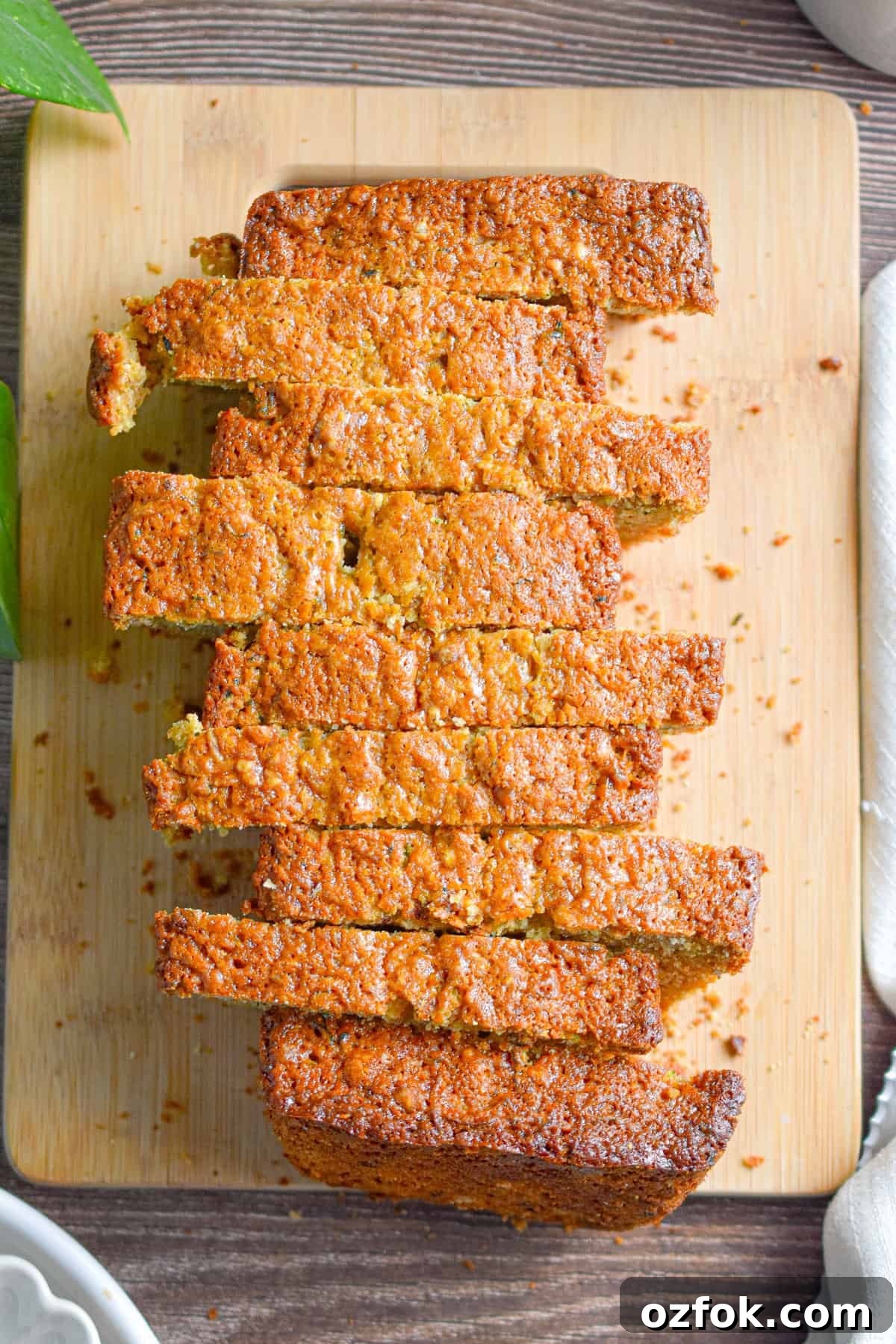 Moist Zucchini Bread Made with Self-Rising Flour 8 The zucchini bread with self rising flour is cut into slices on a cutting board.