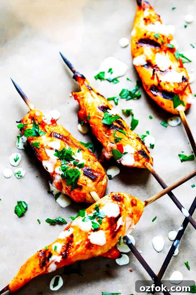 Honey Harissa Chicken Skewers with Garlic-Mint Sauce 6 Plated honey harissa chicken skewers