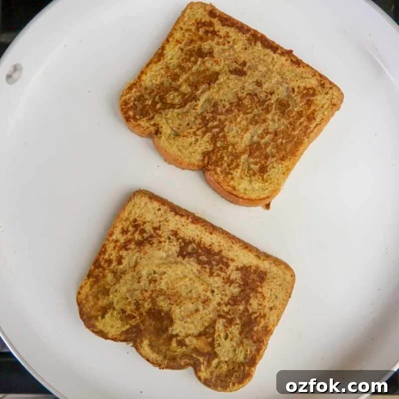 Process shot - flipping french toast when golden brown.