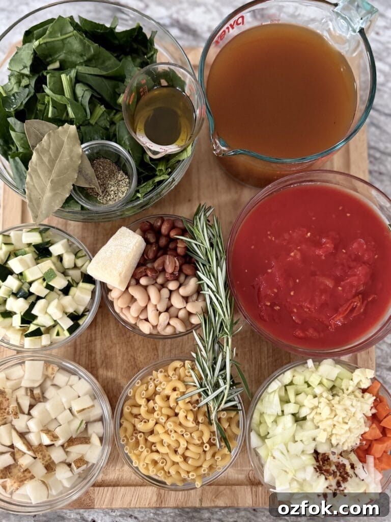 Classic Italian Minestrone Soup Recipe — Hearty Vegetable Stew 5 Prepped ingredients for the best italian minestrone soup recipe in glass bowls on cutting board.