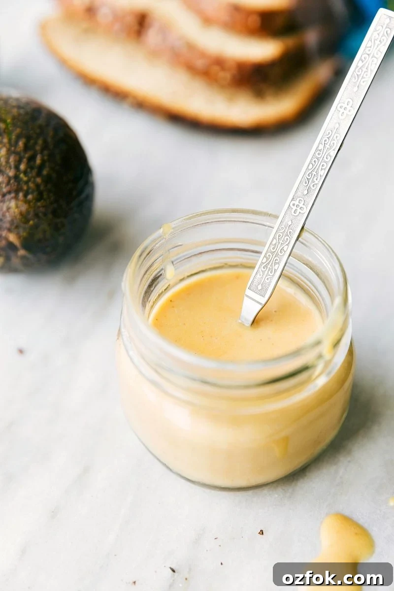 The best honey mustard spread mixed together in a mason jar.