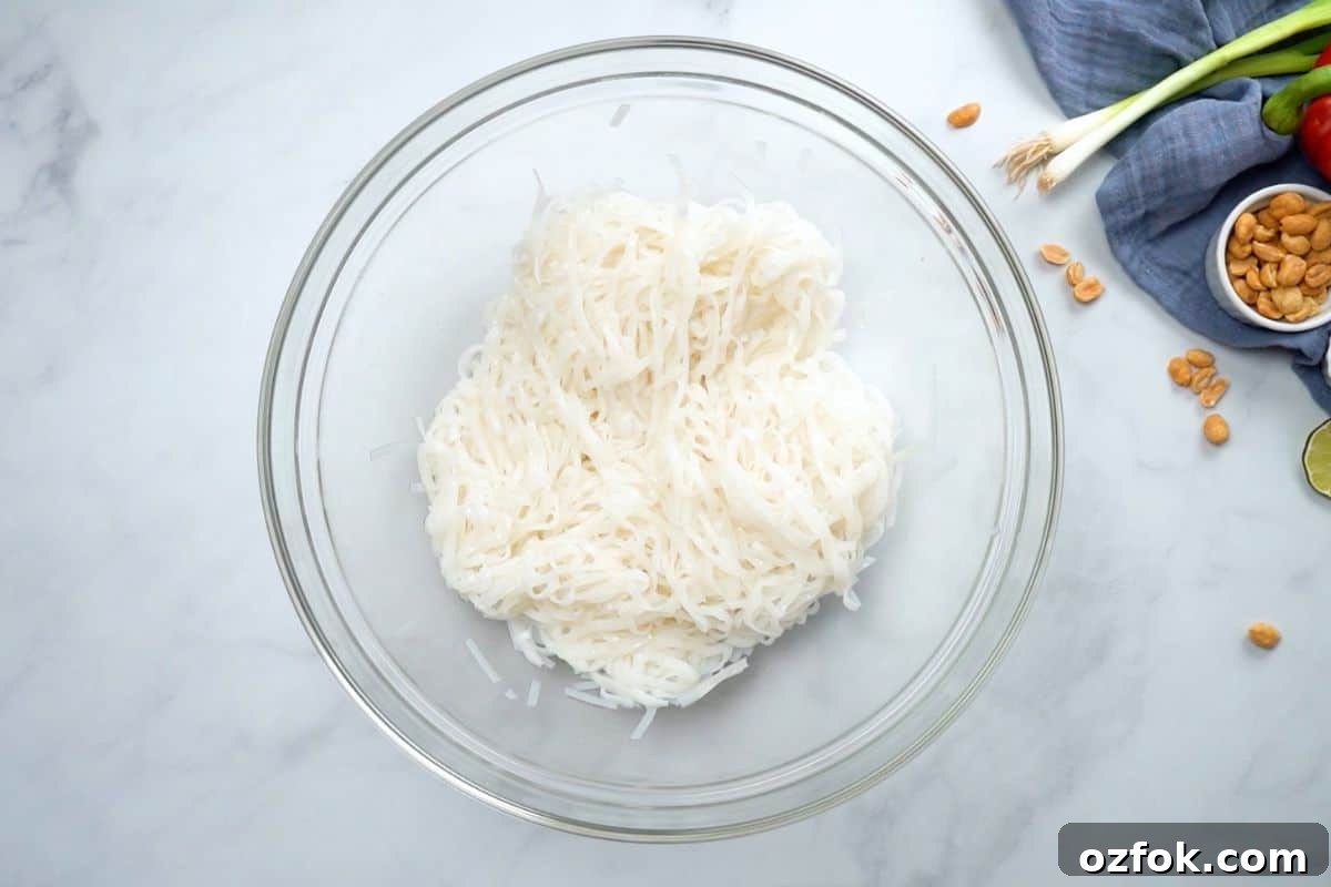 Homemade Thai Noodle Recipe Bowl of rice noodles tossed with canola oil to form thai noodles