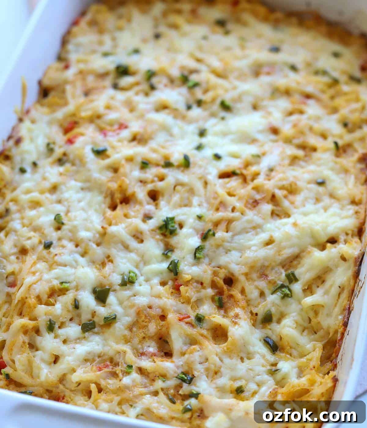 12 Quick Weeknight Dinners Made with Rotisserie Chicken 8 Cheesy Hash Brown Chicken Casserole in 9x13 dish.