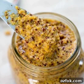 Homemade Whole-Grain Mustard Recipe: Bold Flavor in Minutes 7 A clear glass jar with Mustard