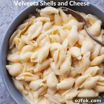 Instant Pot Rigatoni with Savory Meatballs in Marinara 8 Velveeta shells and cheese in a grey bowl with a spoon