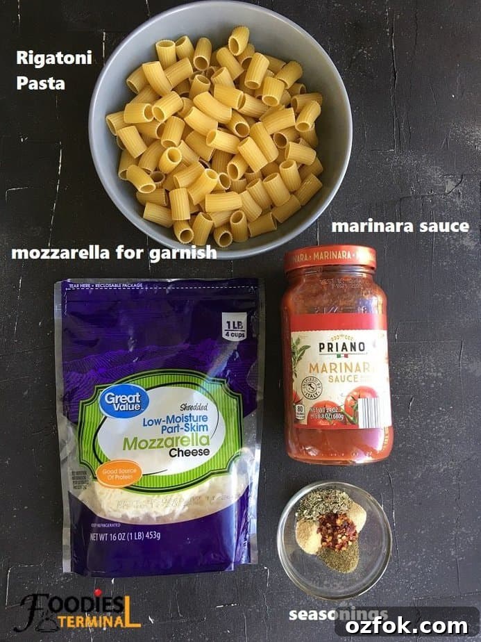 Instant Pot Rigatoni with Savory Meatballs in Marinara 2 recipe ingredients on a black surface