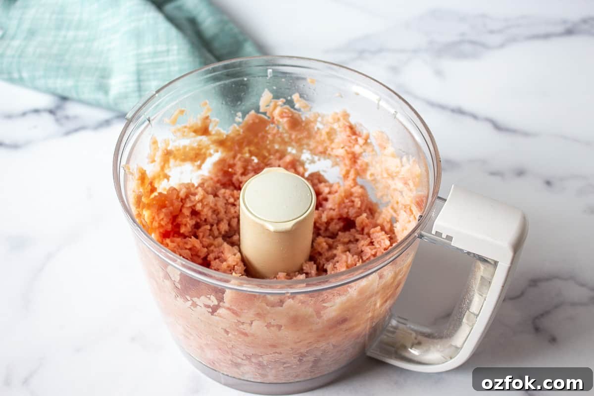 Classic Creamy Ham Salad Recipe for Sandwiches and Dips 5 Finely chopped ham in a food processor bowl.