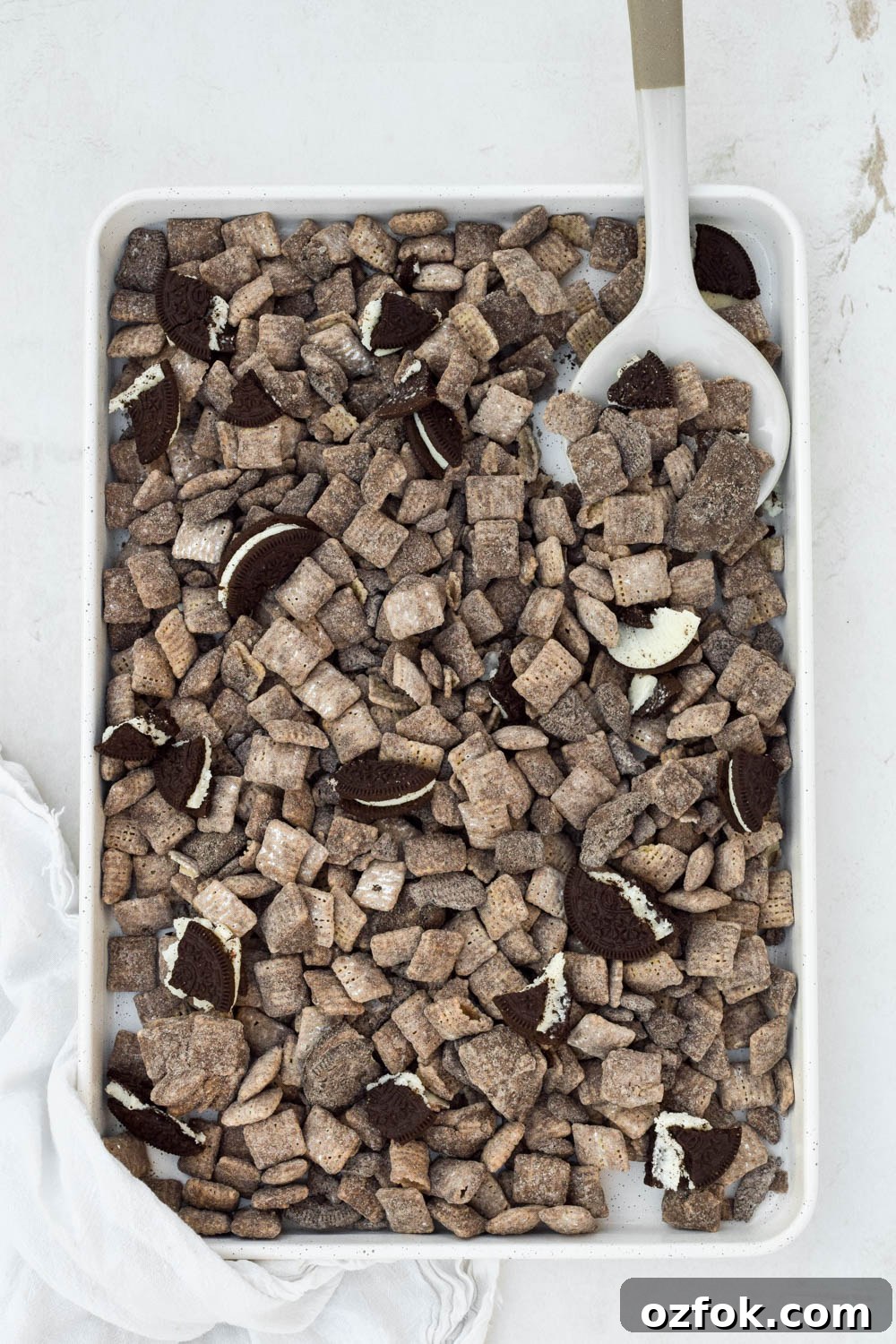 Oreo Muddy Buddies (Oreo Puppy Chow) — No-Bake Chocolate Snack 7 finished oreo puppy chow on tray