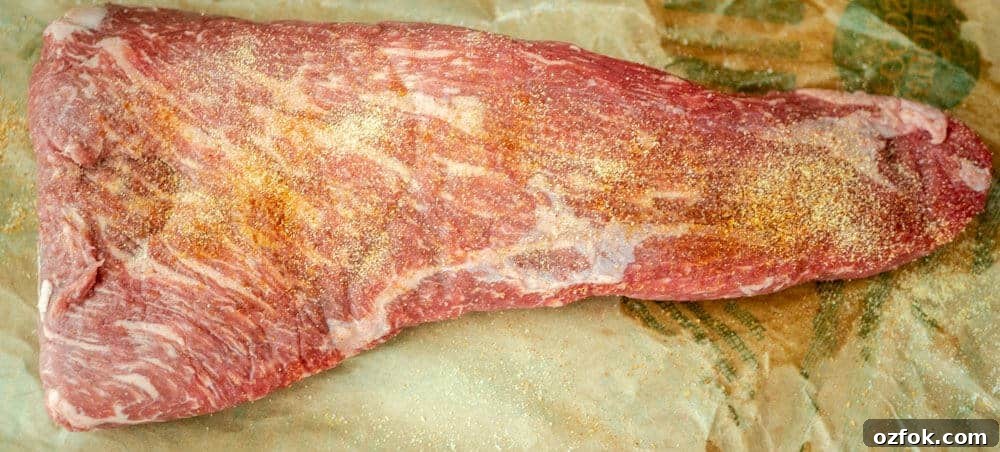 Perfect Oven-Roasted Tri-Tip with Garlic and Herb Crust 4 Seasoned raw tri tip roast ready for cooking.