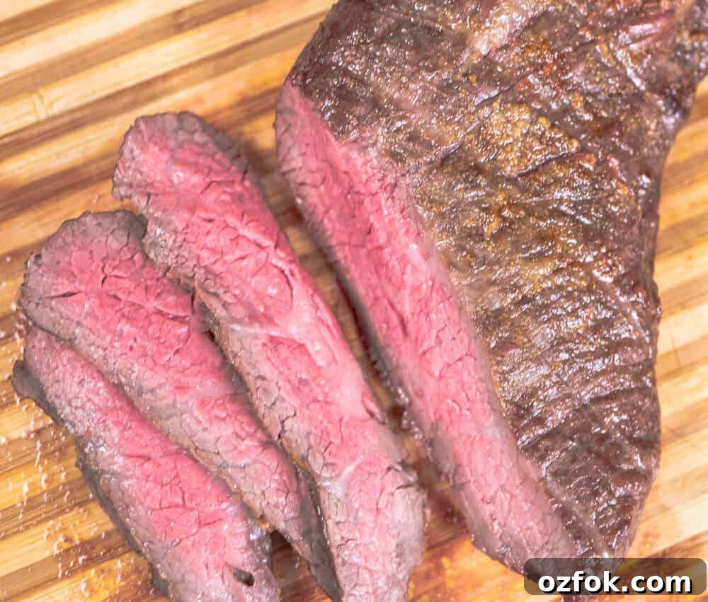 Perfect Oven-Roasted Tri-Tip with Garlic and Herb Crust 6 Sliced Tri Tip Roast. Perfectly cooked.