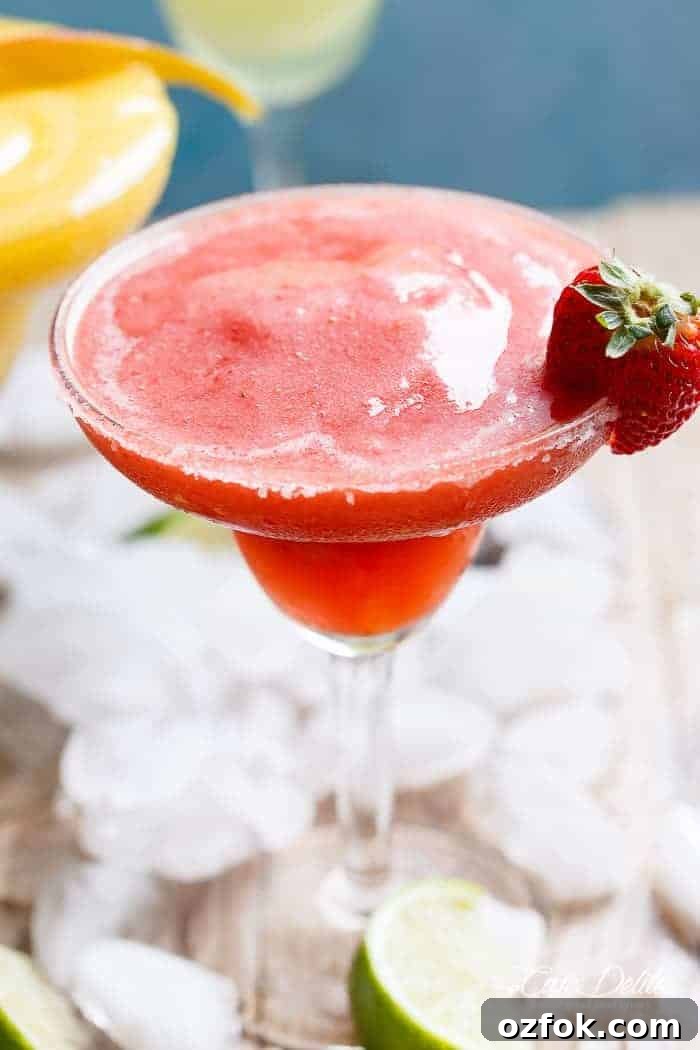 Frozen Strawberry Mango Margarita Recipe | Refreshing Summer Cocktail 6 Frozen Strawberry Margaritas in a glass
