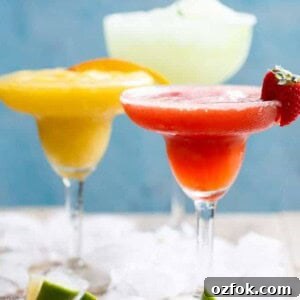 Frozen Strawberry Mango Margarita Recipe | Refreshing Summer Cocktail 7 Frozen Strawberry and Mango Margaritas in a glass