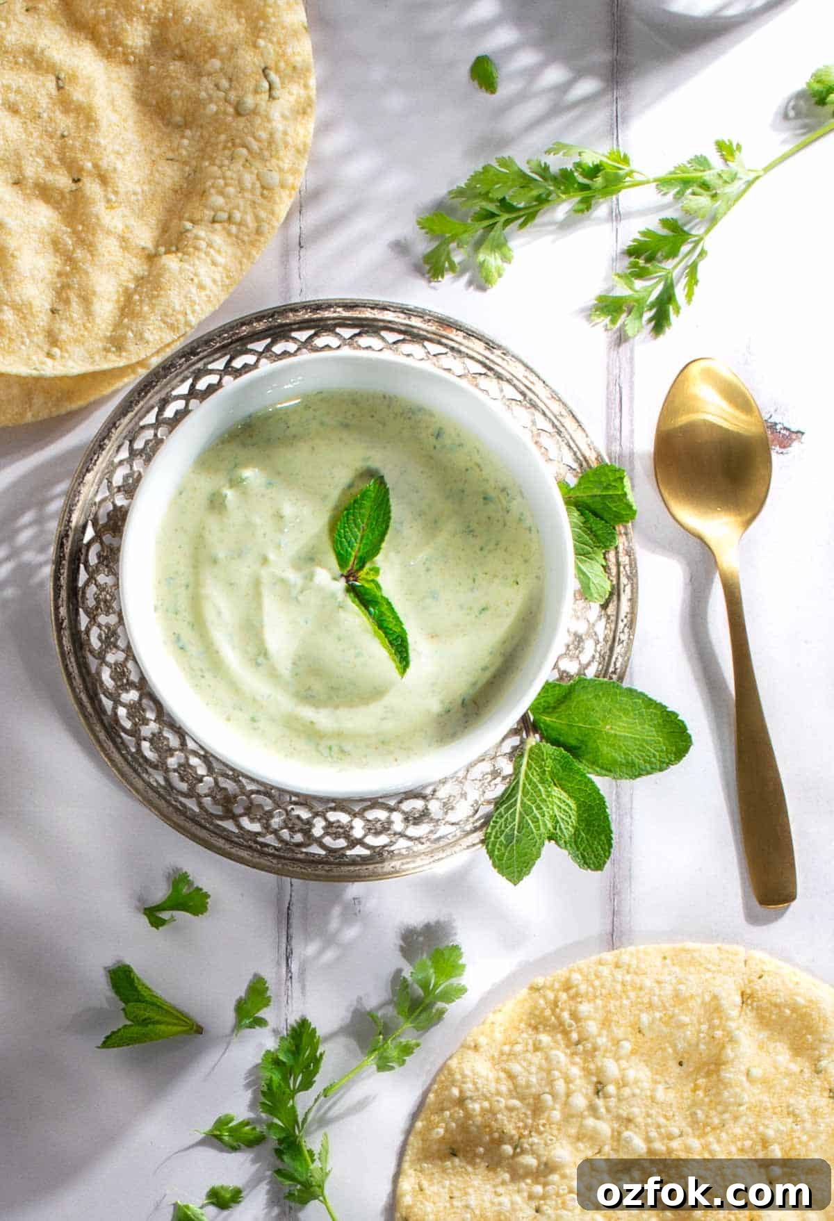 Authentic Indian Mint Chutney Recipe for Grilled Meats and Snacks 2 Indian mint sauce in a white bowl.