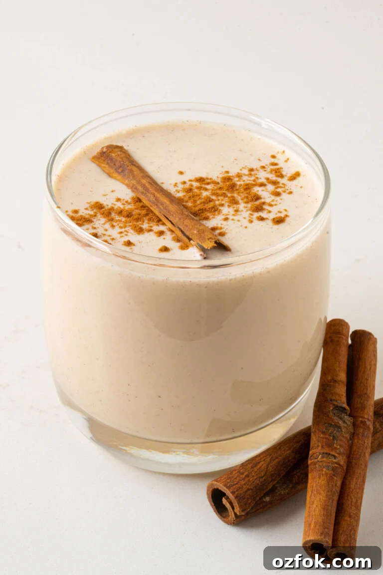 a glass of coquito on a counter