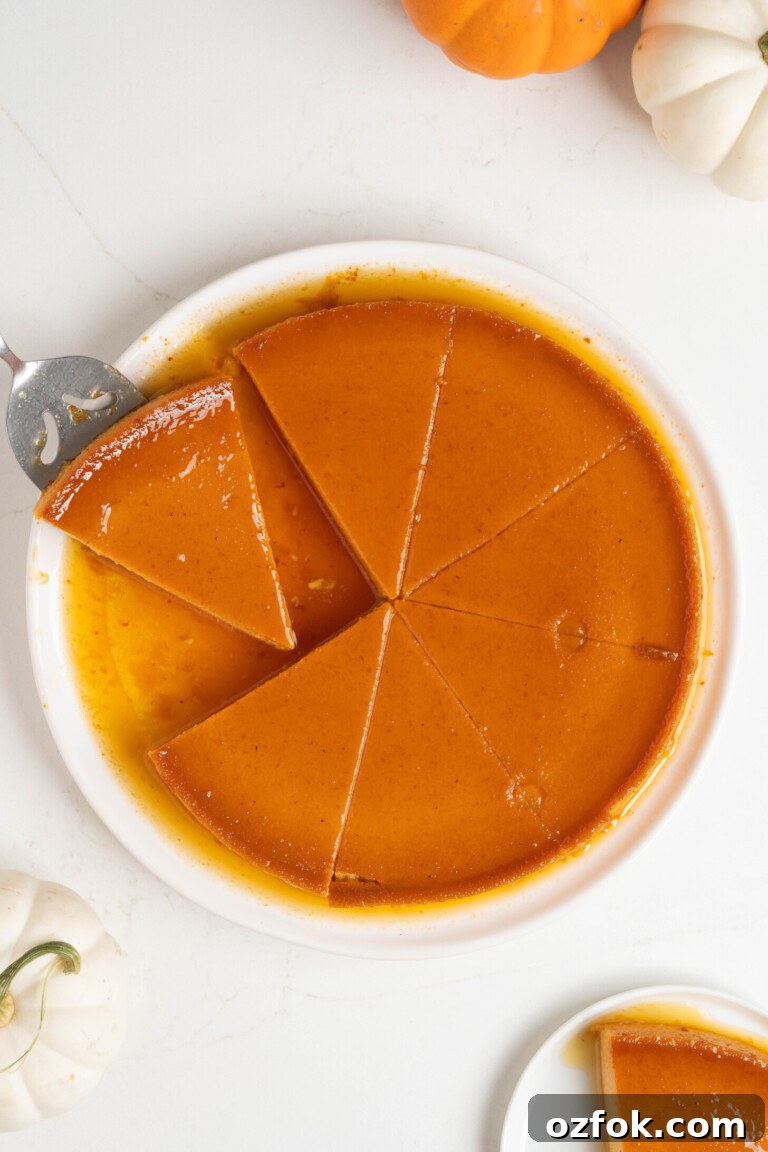 Sliced pumpkin flan on a white plate.