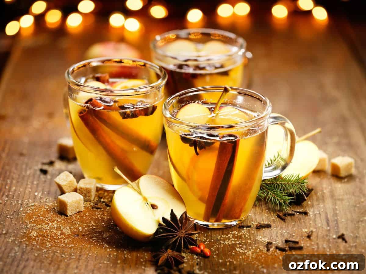 Guide to Cocktail Glasses: Styles, Uses, and Cocktail Pairings 11 Hot apple cider in a mug with cinnamon stick,
