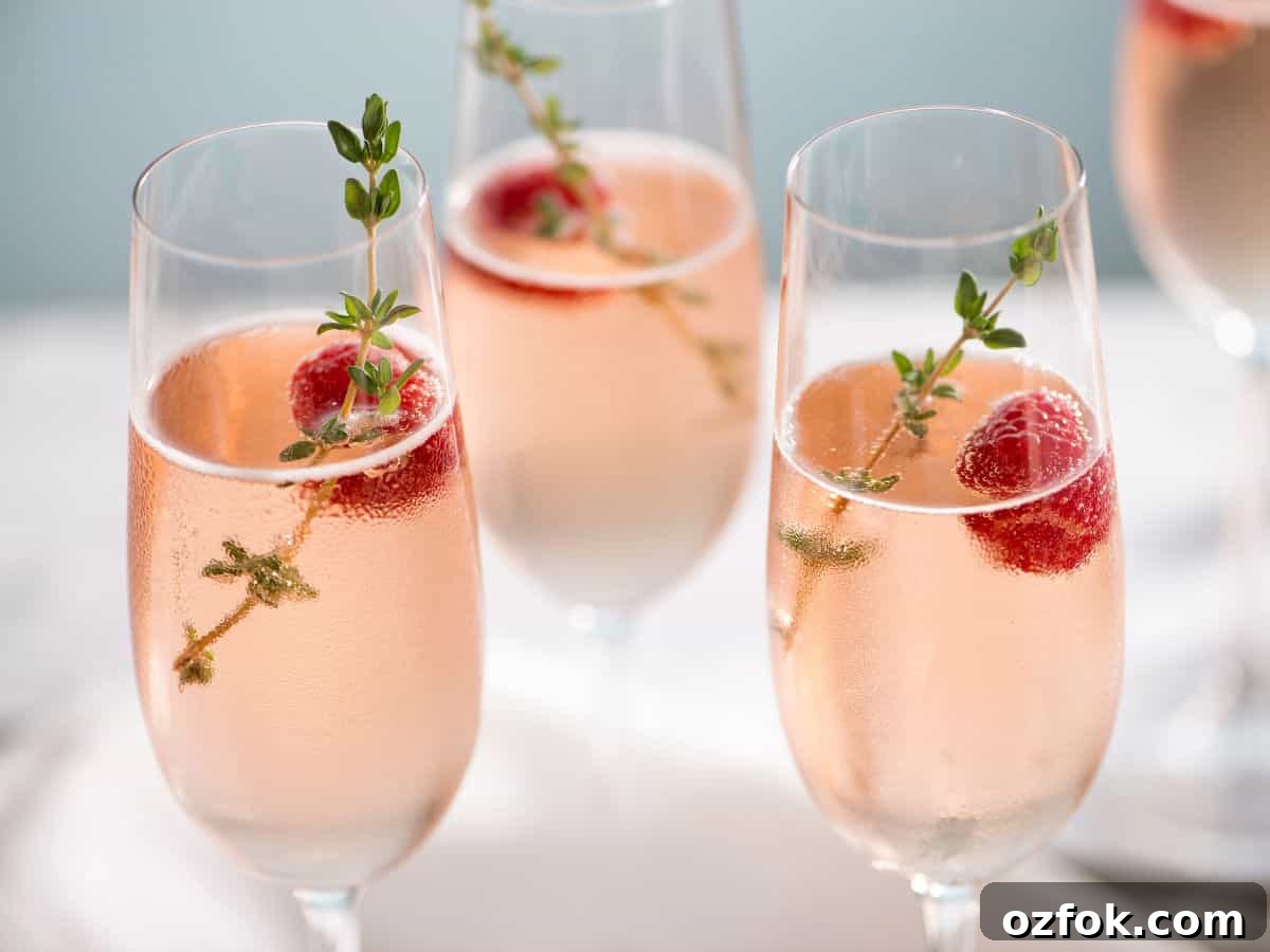 Guide to Cocktail Glasses: Styles, Uses, and Cocktail Pairings 4 Champagne glass with champagne and berries.
