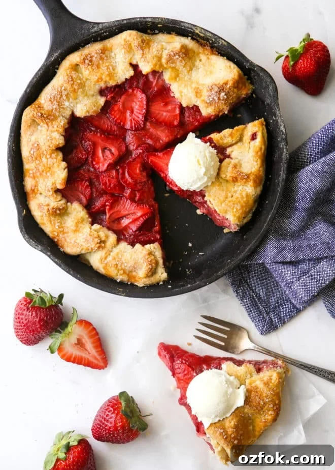 Skillet Strawberry Pie: Sweet, Quick Pan-Baked Dessert 7 strawberry skillet pie with a slice on the side, scoops of ice cream on top