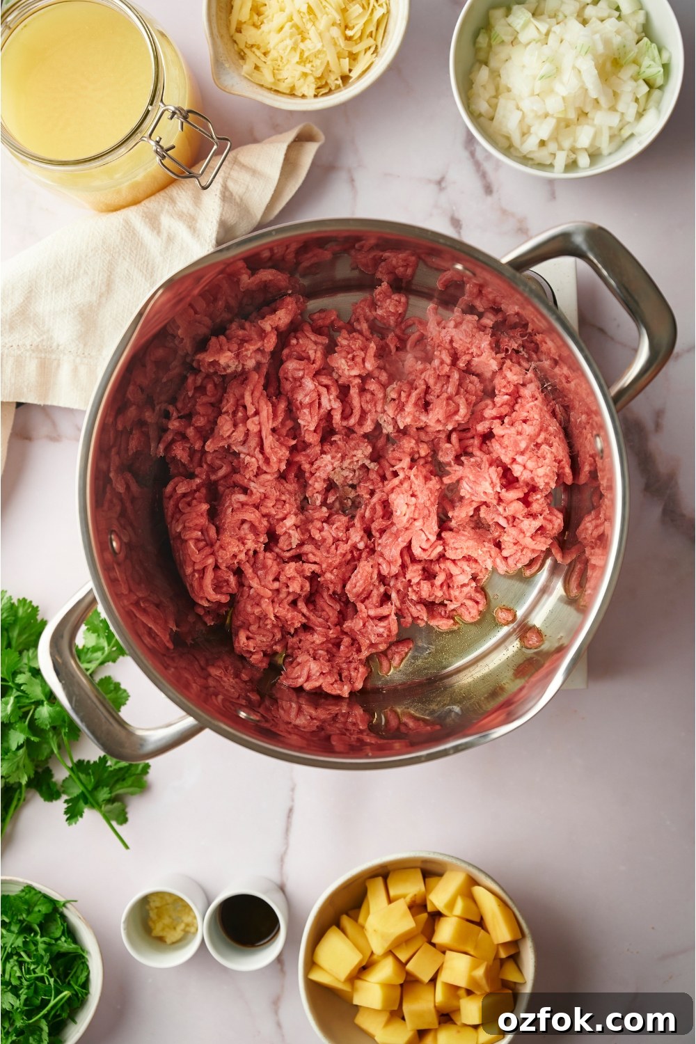 30-Minute Ground Beef and Vegetable Soup Recipe 5 Ground beef in a pot with oil in it.