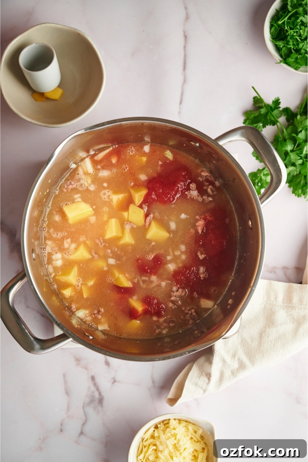 30-Minute Ground Beef and Vegetable Soup Recipe 8 Crushed tomatoes in a broth with potatoes and ground beef.