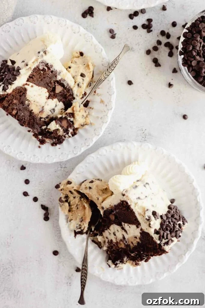 Cookie Dough Fudge Brownie Cake Recipe for Decadent Desserts 14 taking a bite of slices of chocolate cake with cookie dough