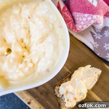 Creamy Classic Egg Salad Recipe for Sandwiches and Lunch 8 White bowl with egg salad spread and coated bread on brown board.