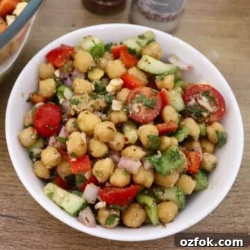 mediterranean chickpea salad in a white colored bowl.