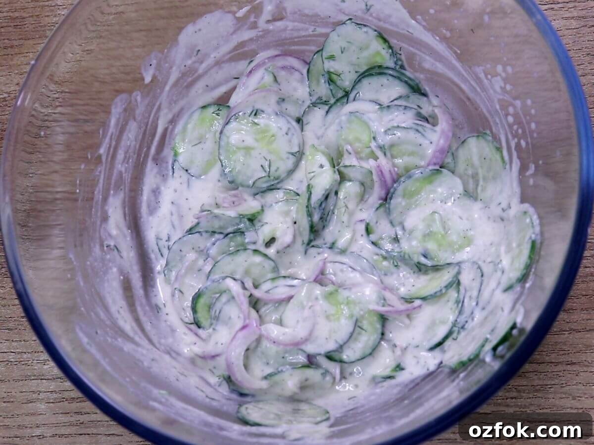 Creamy Greek Yogurt Cucumber Salad with Dill and Lemon 7 greek yogurt cucumber salad with in a glass bowl.