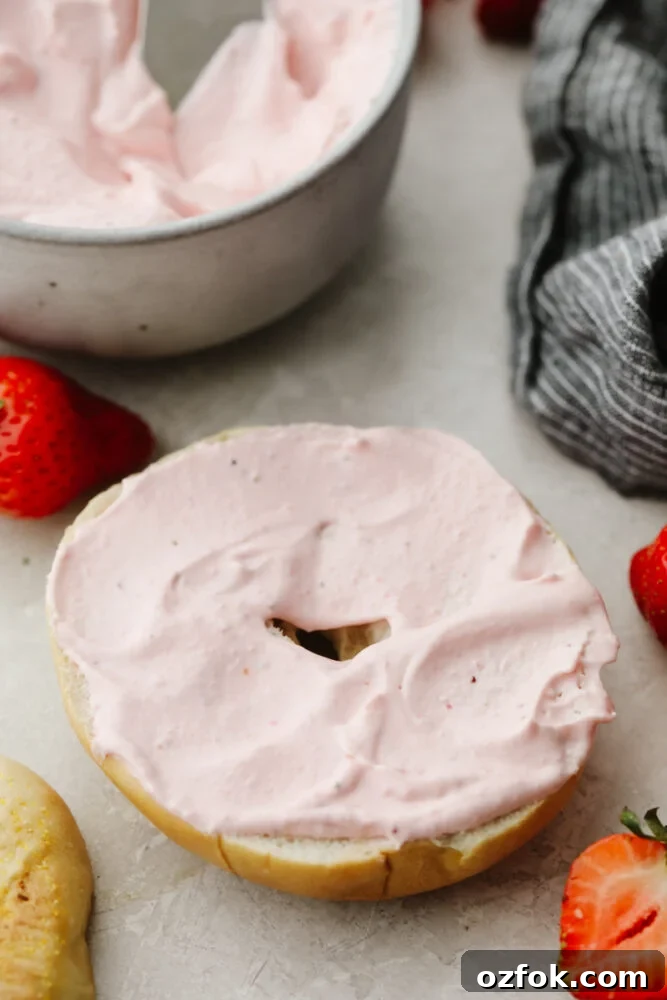 Strawberry cream cheese Strawberry cream cheese on a bagel.
