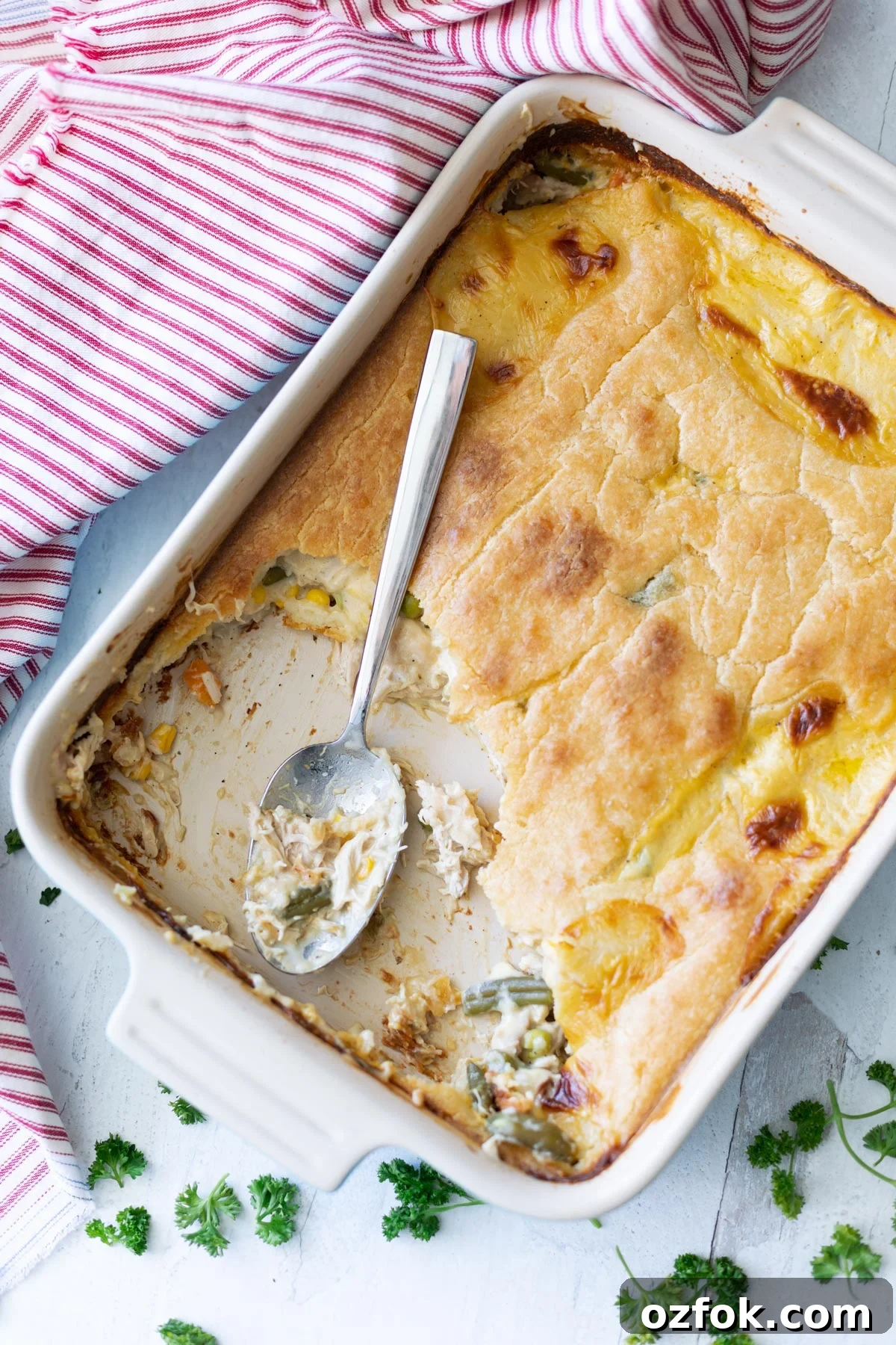 Pyrex pan of cooked pot pie after servings have been removed.