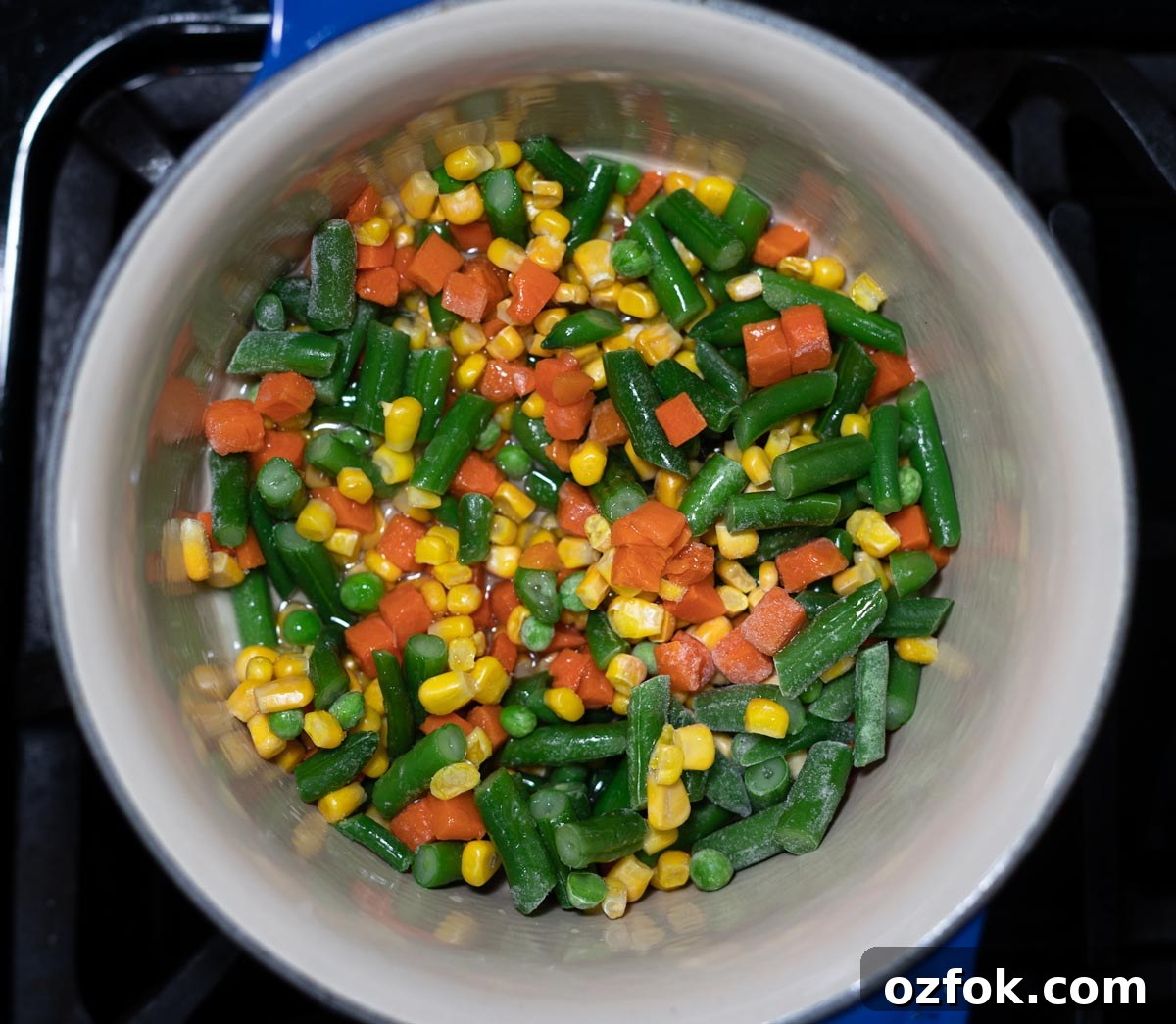 A sauce pan of mixed vegetables.
