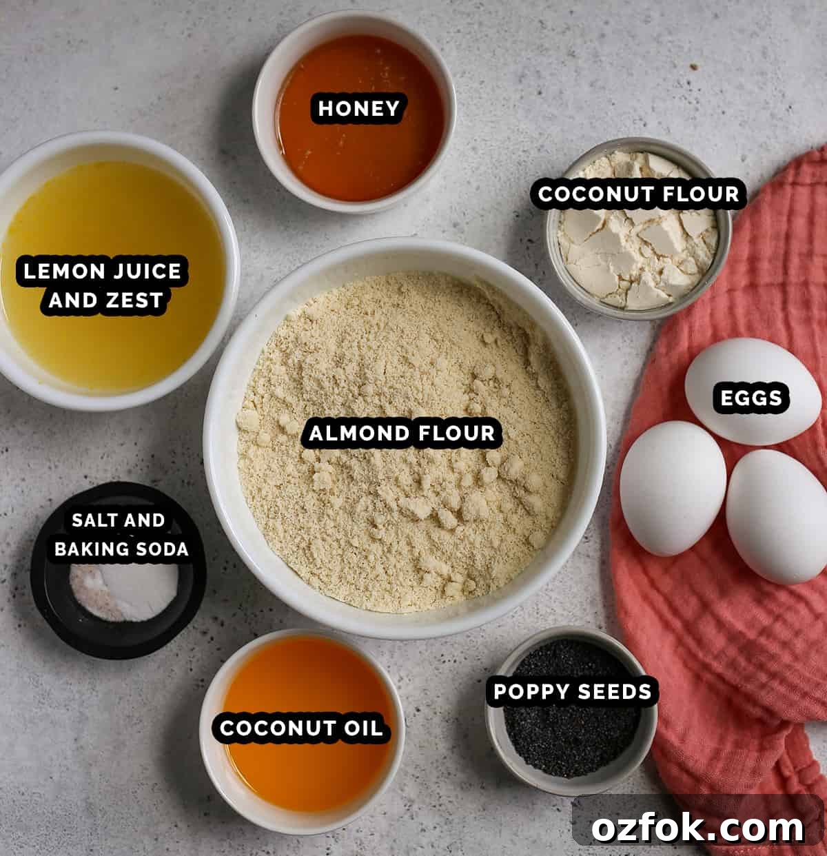 Paleo Lemon Poppy Seed Loaf — Gluten-Free Citrus Bread 3 All the ingredients for paleo lemon poppy seed bread in individual bowls, labeled.