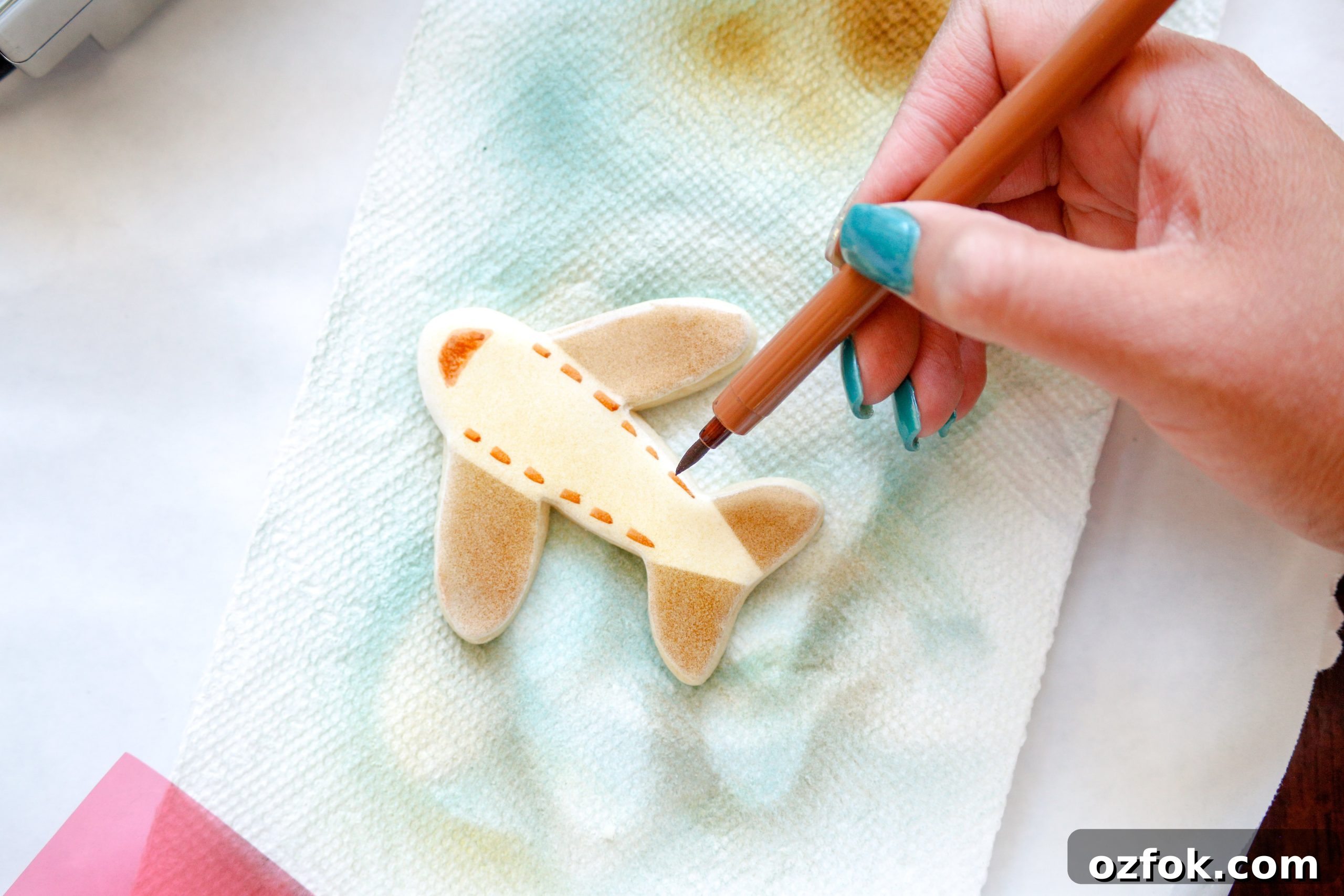 Travel-Inspired Sugar Cookies: Step-by-Step Decorating Tutorial 11 Use edible food markers to add details to sugar cookies