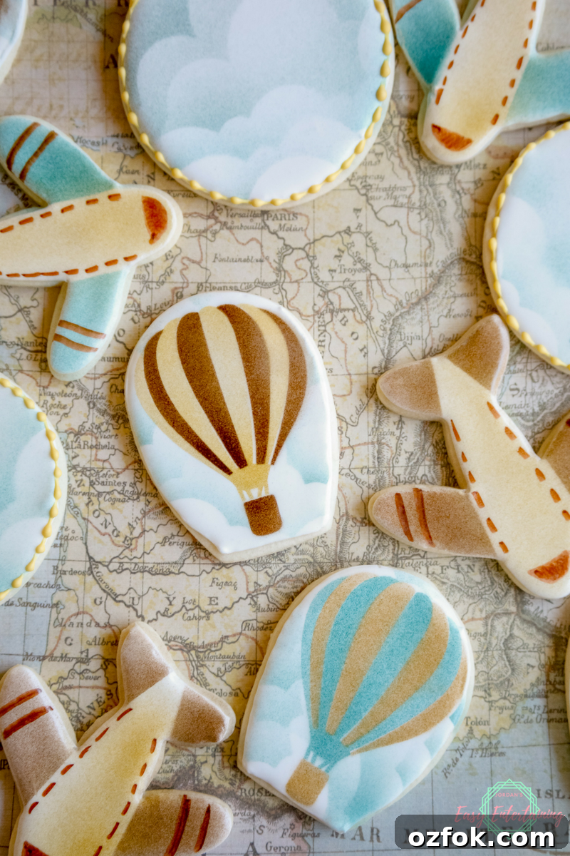 Travel-Inspired Sugar Cookies: Step-by-Step Decorating Tutorial 13 Hot air balloon, airplane, and cloud cookies for a travel themed baby shower