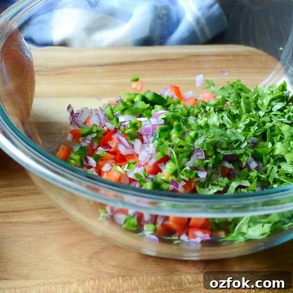 Calamari, Avocado & Grapefruit Bruschetta Recipe 4 Chopped vegetables in a bowl.
