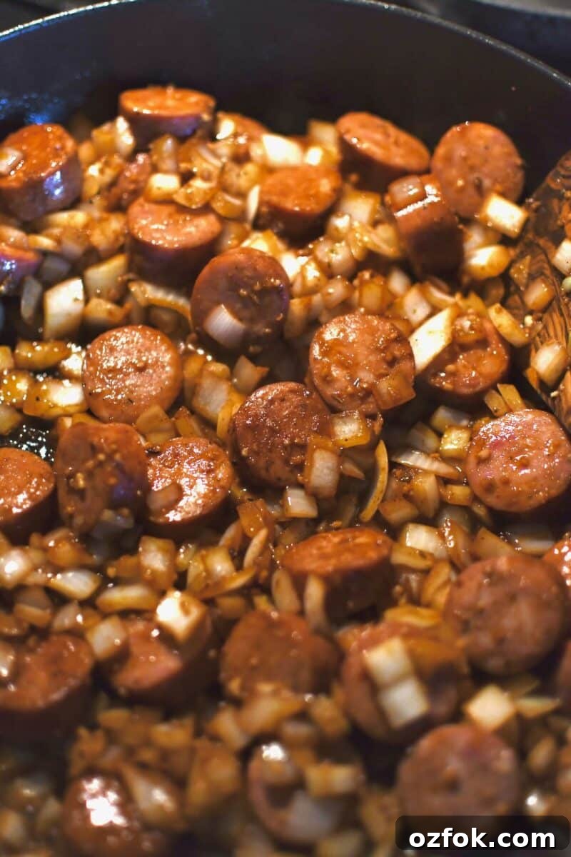 Onion, garlic, and sausage cooked in the pan after the chicken.