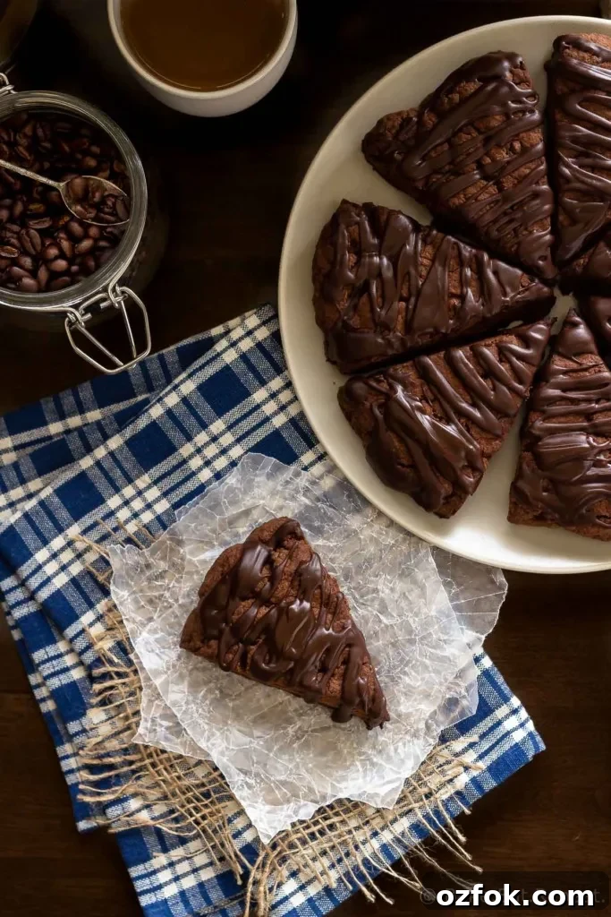 Decadent Double Chocolate Scones Recipe for Chocolate Lovers 2 These double chocolate scones are easy to make and are decadent enough to be dessert, but since they're scones you can probably justify having them for breakfast! Buttery and flaky chocolate scones, filled with chocolate chips, and topped with a chocolate glaze - in short, they're amazing.