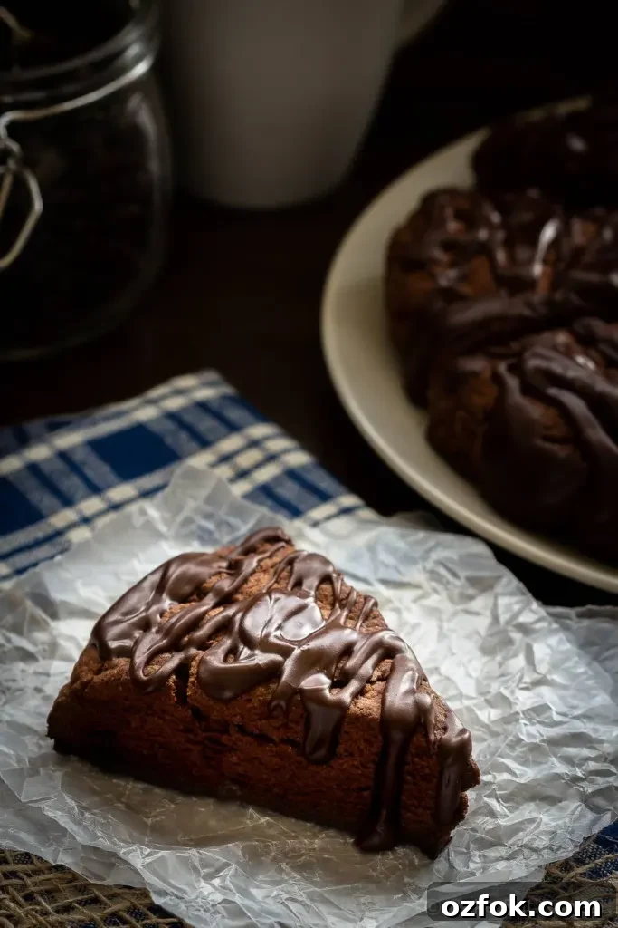 Decadent Double Chocolate Scones Recipe for Chocolate Lovers 4 These double chocolate scones are easy to make and are decadent enough to be dessert, but since they're scones you can probably justify having them for breakfast! Buttery and flaky chocolate scones, filled with chocolate chips, and topped with a chocolate glaze - in short, they're amazing.