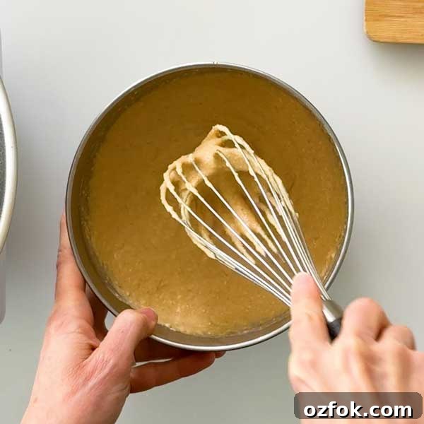 Fluffy Gluten-Free Oat Flour Protein Pancakes 6 Mixing the pancake batter with a whisk