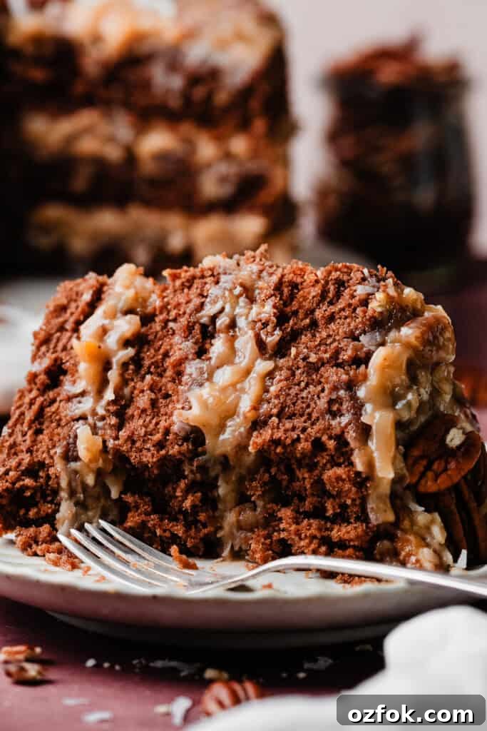 Ultimate German Chocolate Cake Recipe for Rich, Layered Flavor 3 A close-up of a slice of german chocolate cake with a few bites missing.