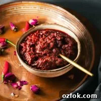 Homemade Rose Harissa Paste Recipe for Vibrant Flavor 11 A bowl of homemade rose harissa paste on a Middle Eastern serving tray.
