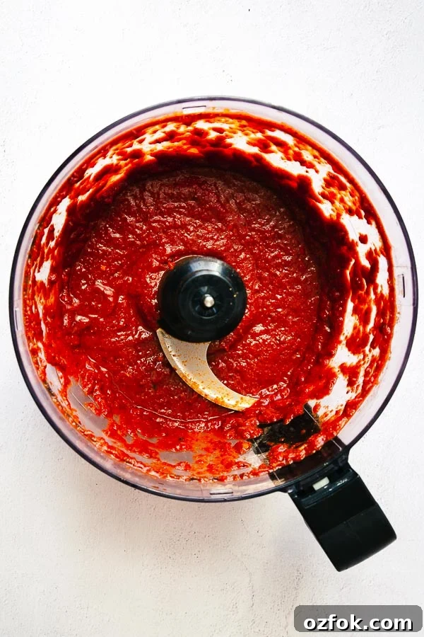 Homemade Rose Harissa Paste Recipe for Vibrant Flavor 8 Making harissa paste in a food processor.