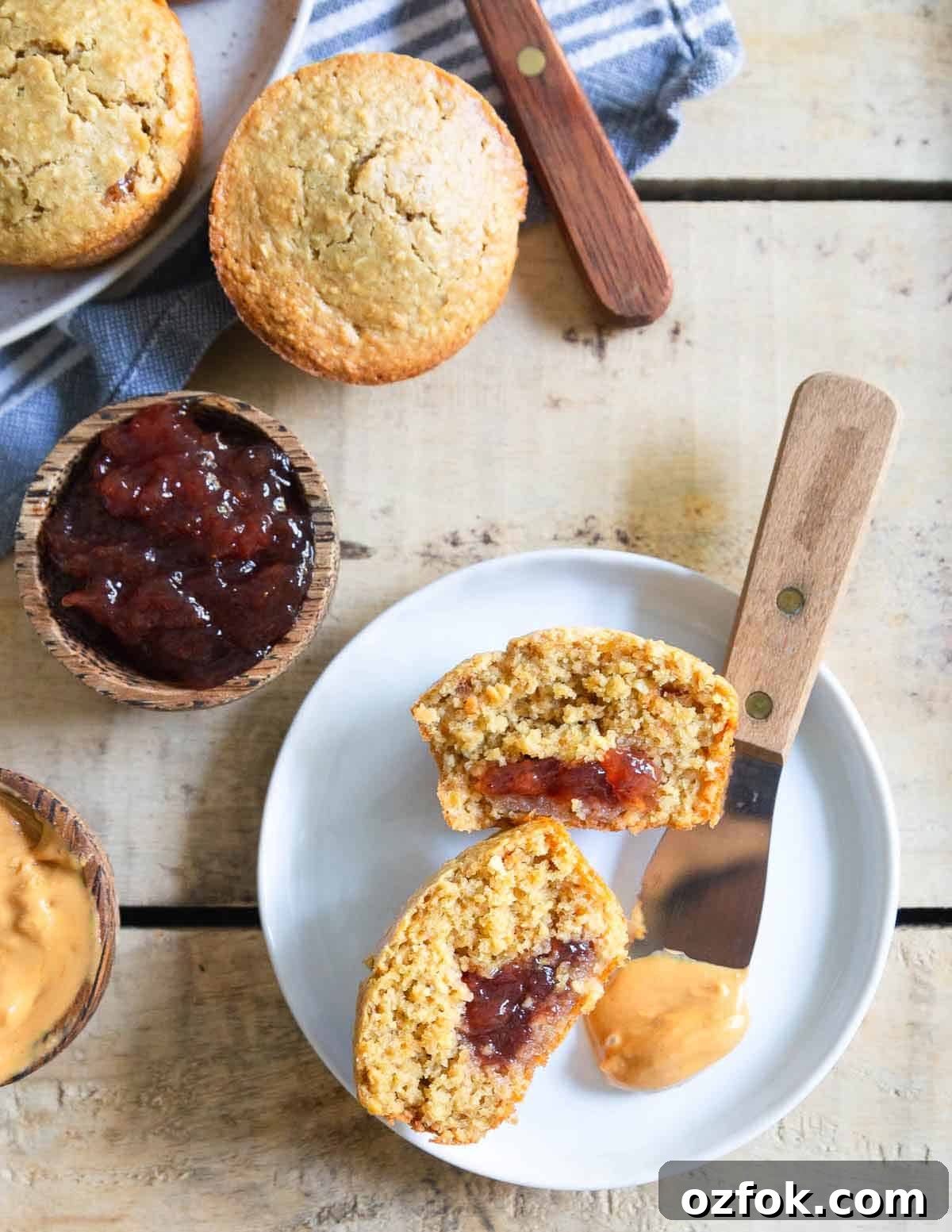 Peanut butter and jelly muffins made with gluten-free oat flour are a tasty afternoon treat!