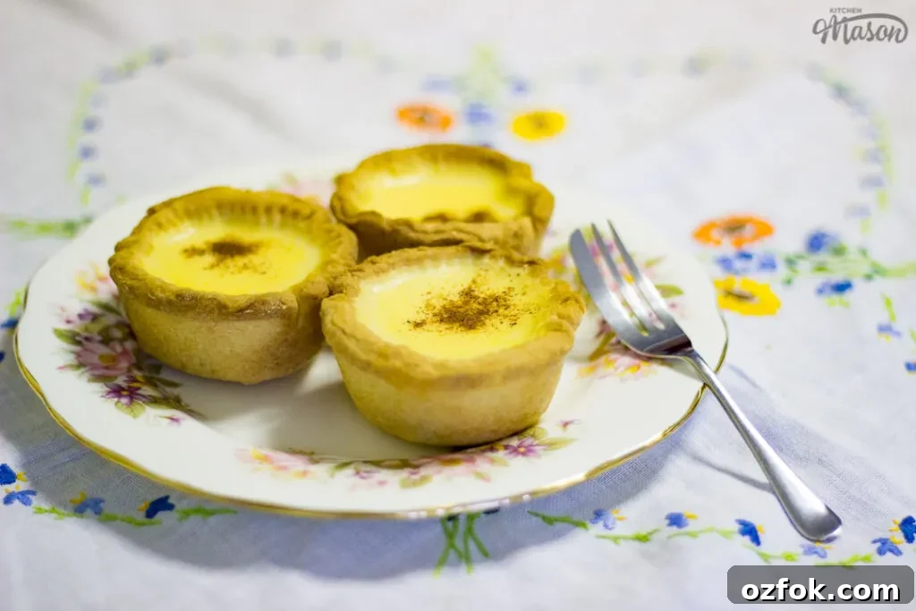 Grandma’s Incredible Ham and Cheese Quiche Recipe 11 3 homemade egg custard tarts on a white floral plate