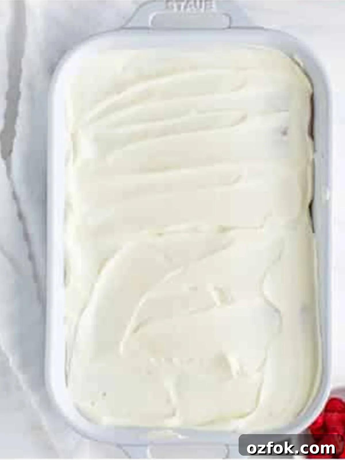 No-Bake Raspberry Icebox Cake Recipe for Summer Parties 13 Plain whipped cream layer spread over the crackers for Raspberry Icebox Cake.