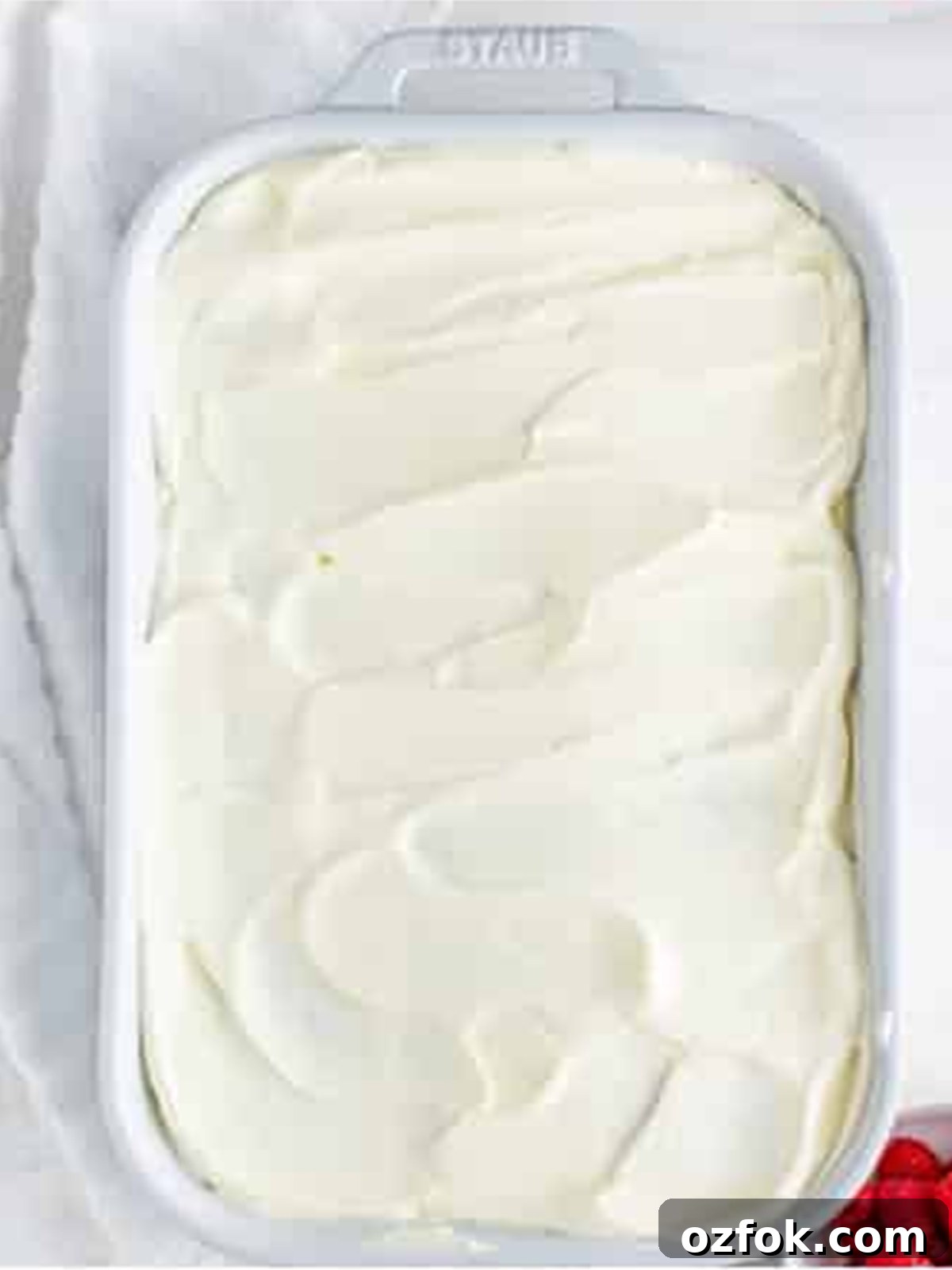 No-Bake Raspberry Icebox Cake Recipe for Summer Parties 15 Raspberry Icebox Cake topped with smooth whipped cream ready to chill.