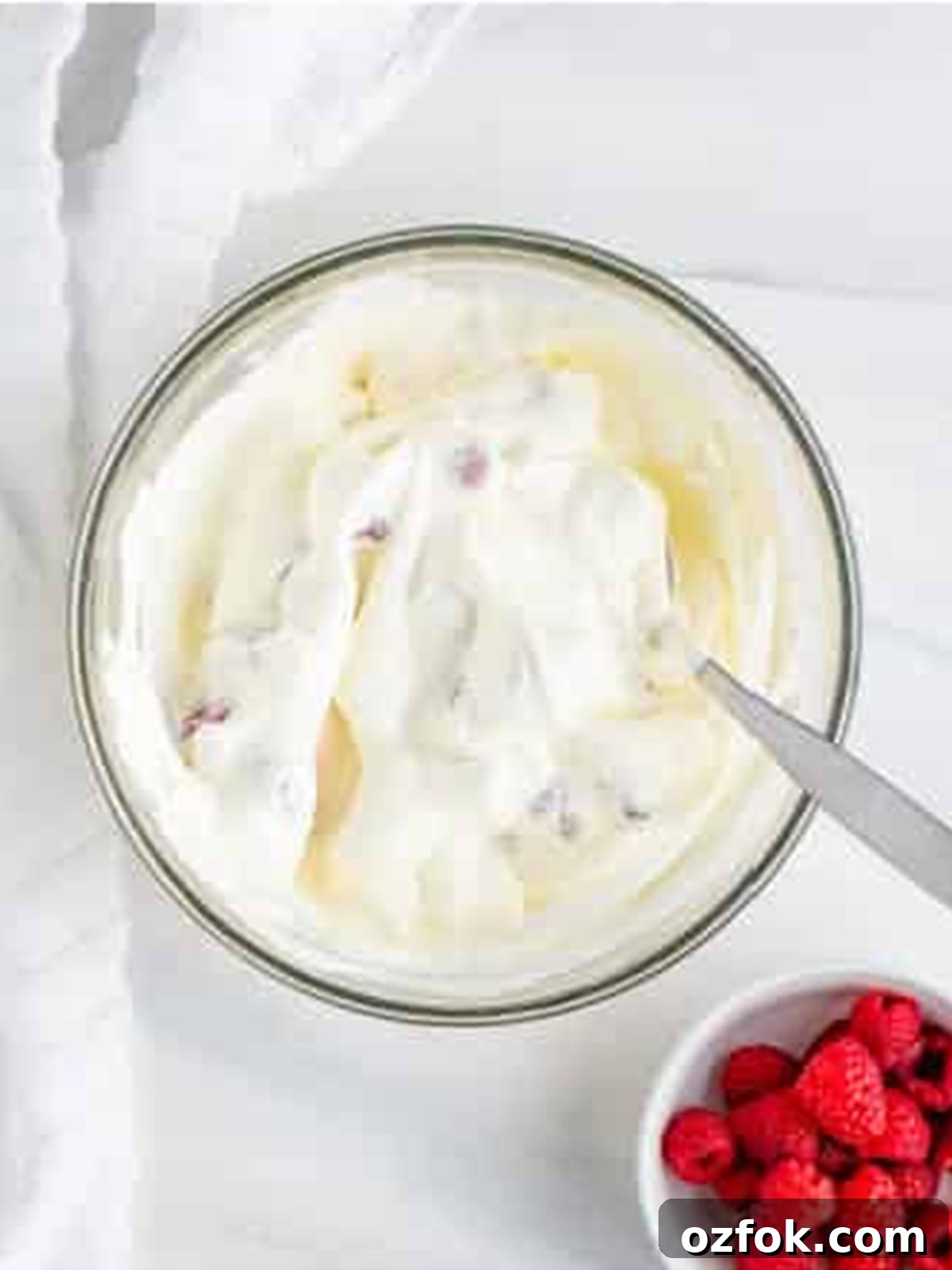 No-Bake Raspberry Icebox Cake Recipe for Summer Parties 6 Fresh raspberries folded into whipped cream for Raspberry Icebox Cake.